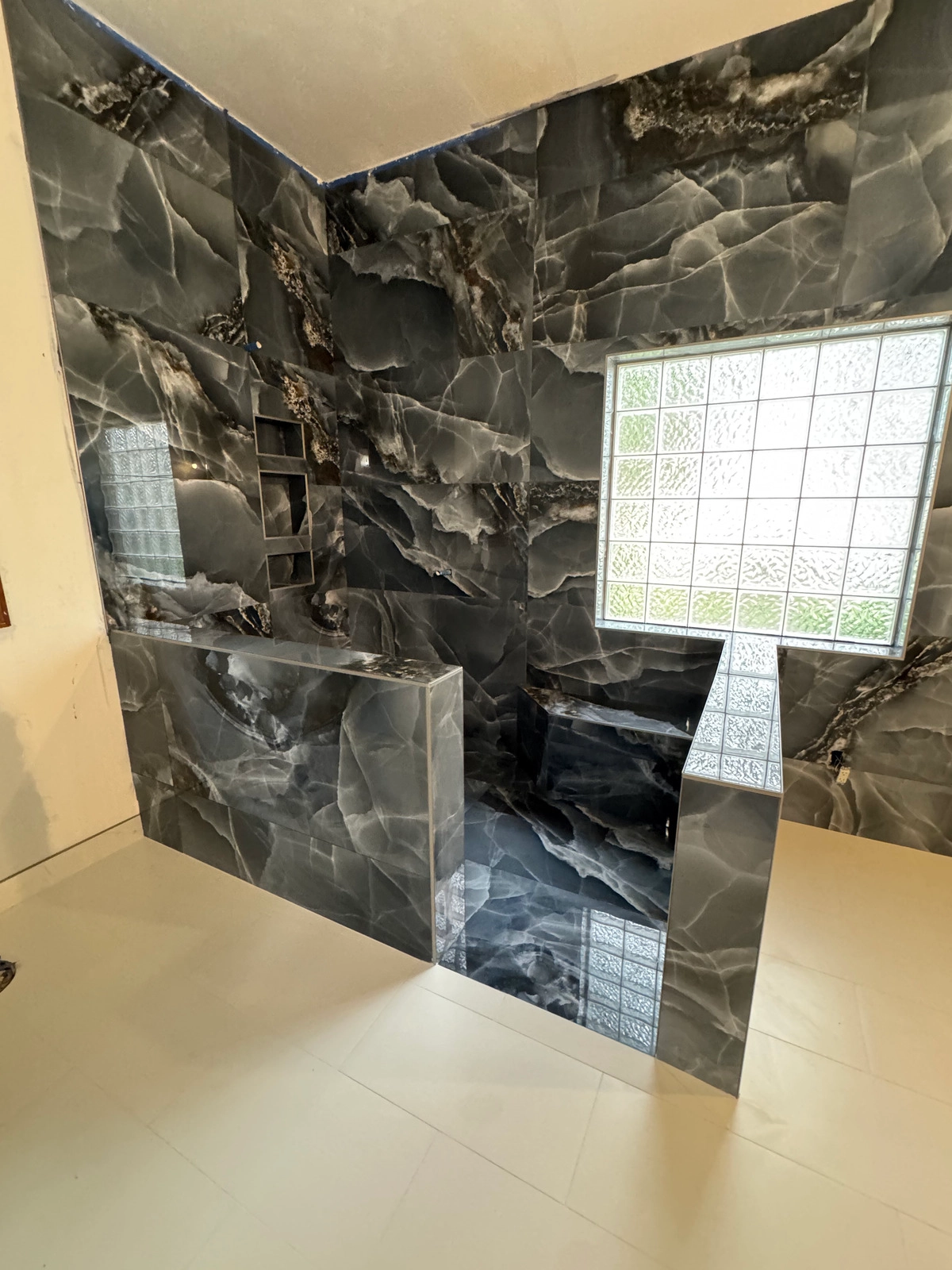 Noliv Construction bathroom remodeling, general renovations and construction, specializing in ceramic tile flooring.