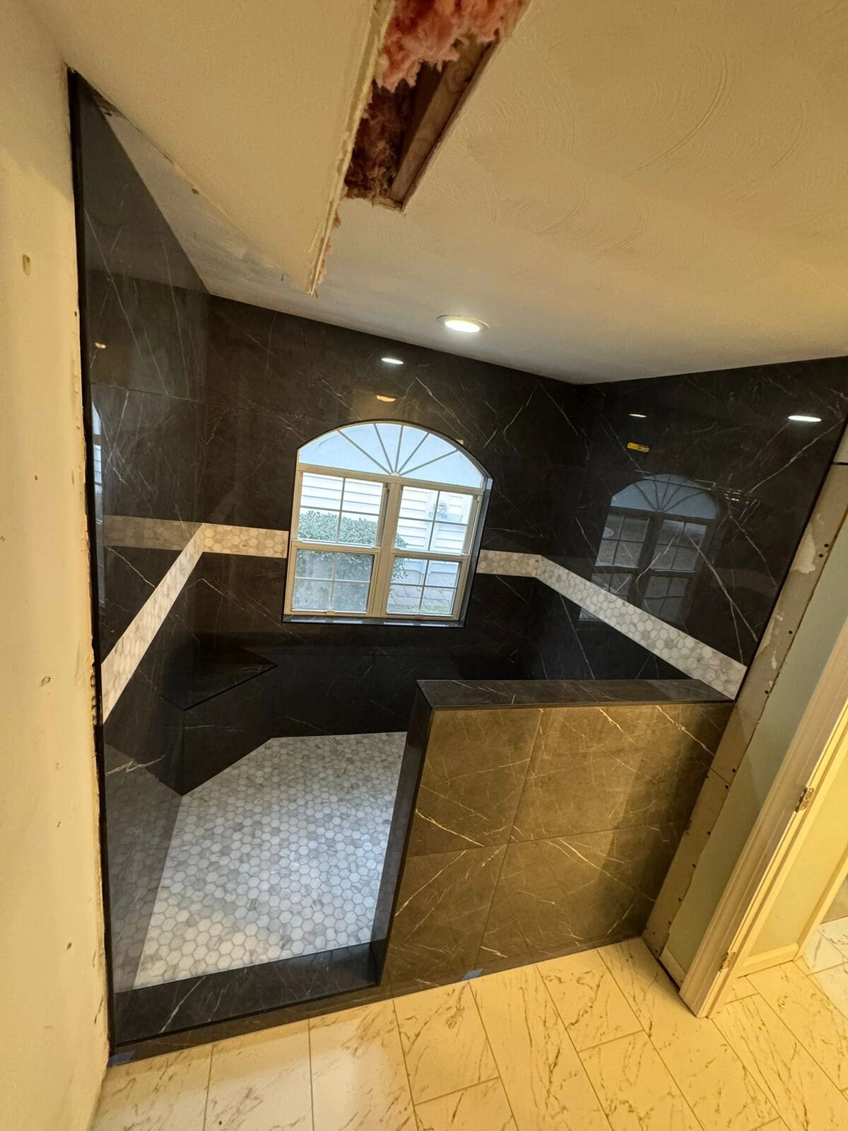 Noliv Construction bathroom remodeling, general renovations and construction, specializing in ceramic tile flooring.