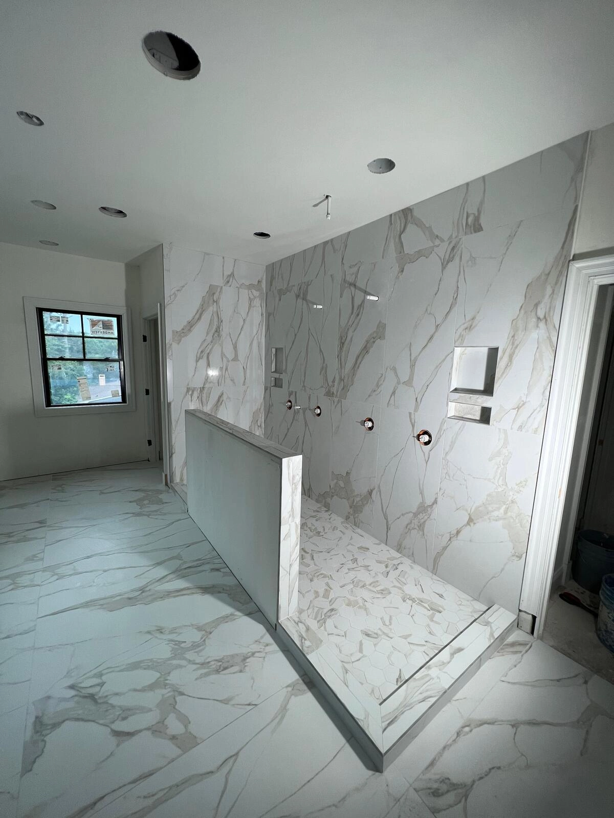 Noliv Construction bathroom remodeling, general renovations and construction, specializing in ceramic tile flooring.