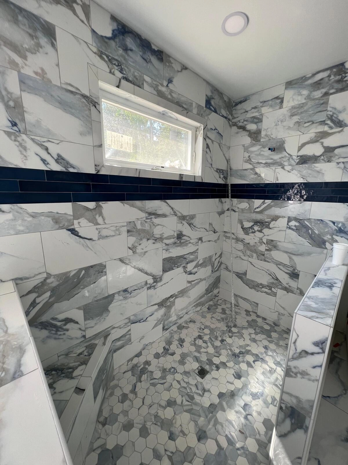 Noliv Construction bathroom remodeling, general renovations and construction, specializing in ceramic tile flooring.