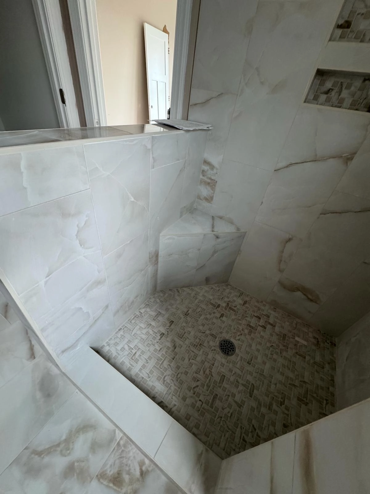 Noliv Construction bathroom remodeling, general renovations and construction, specializing in ceramic tile flooring.